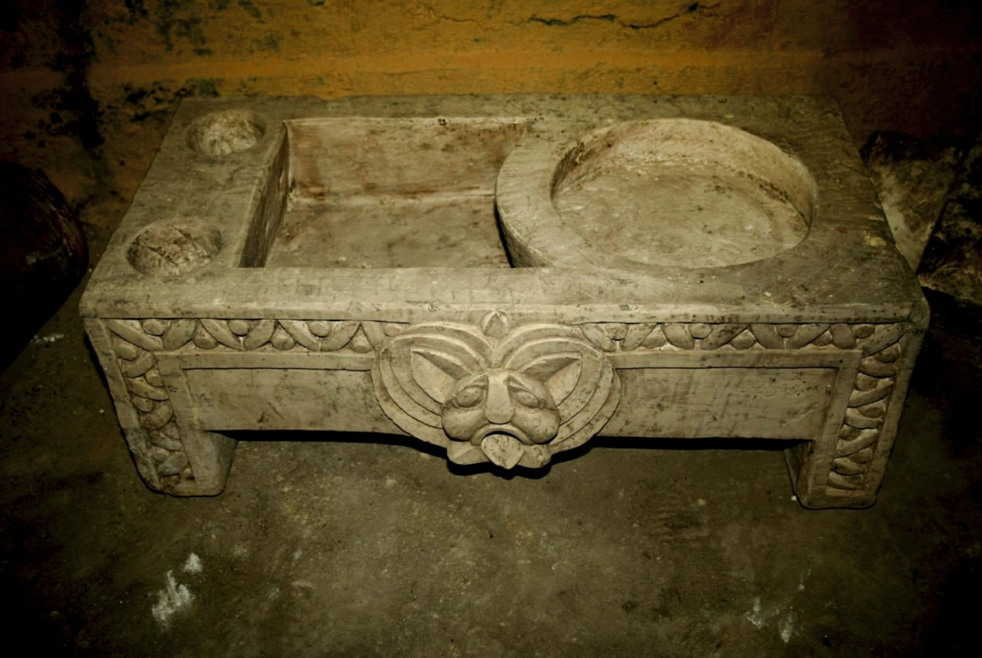 shows a basin in a chamber that was likely used for religious rituals