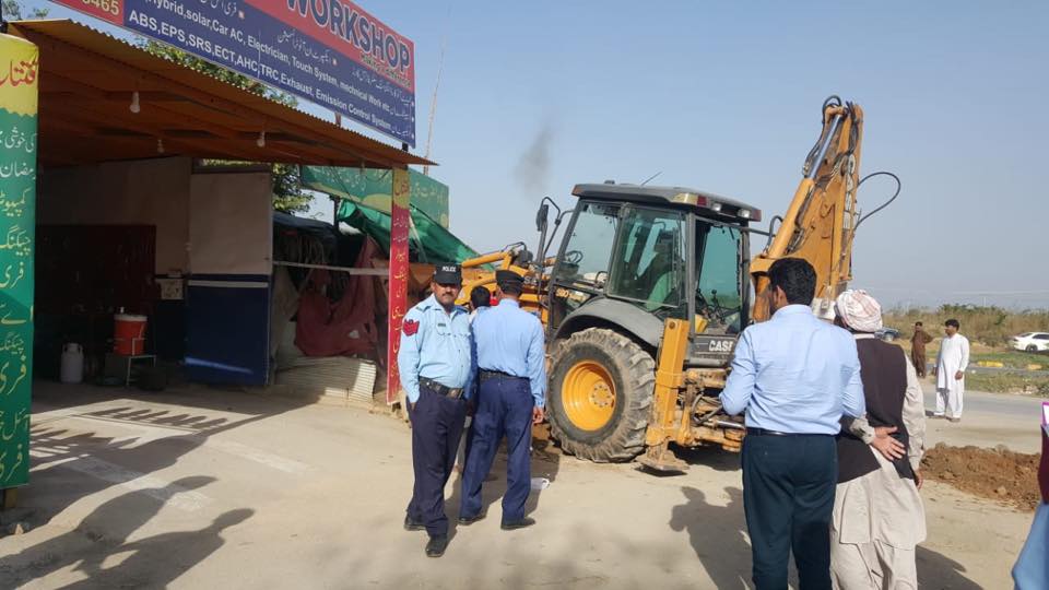 Encroachers trying to build a commercial market in the area reserved for a graveyard 