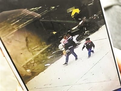 CCTV footage Dai taking her children to the pond PC: CGTN