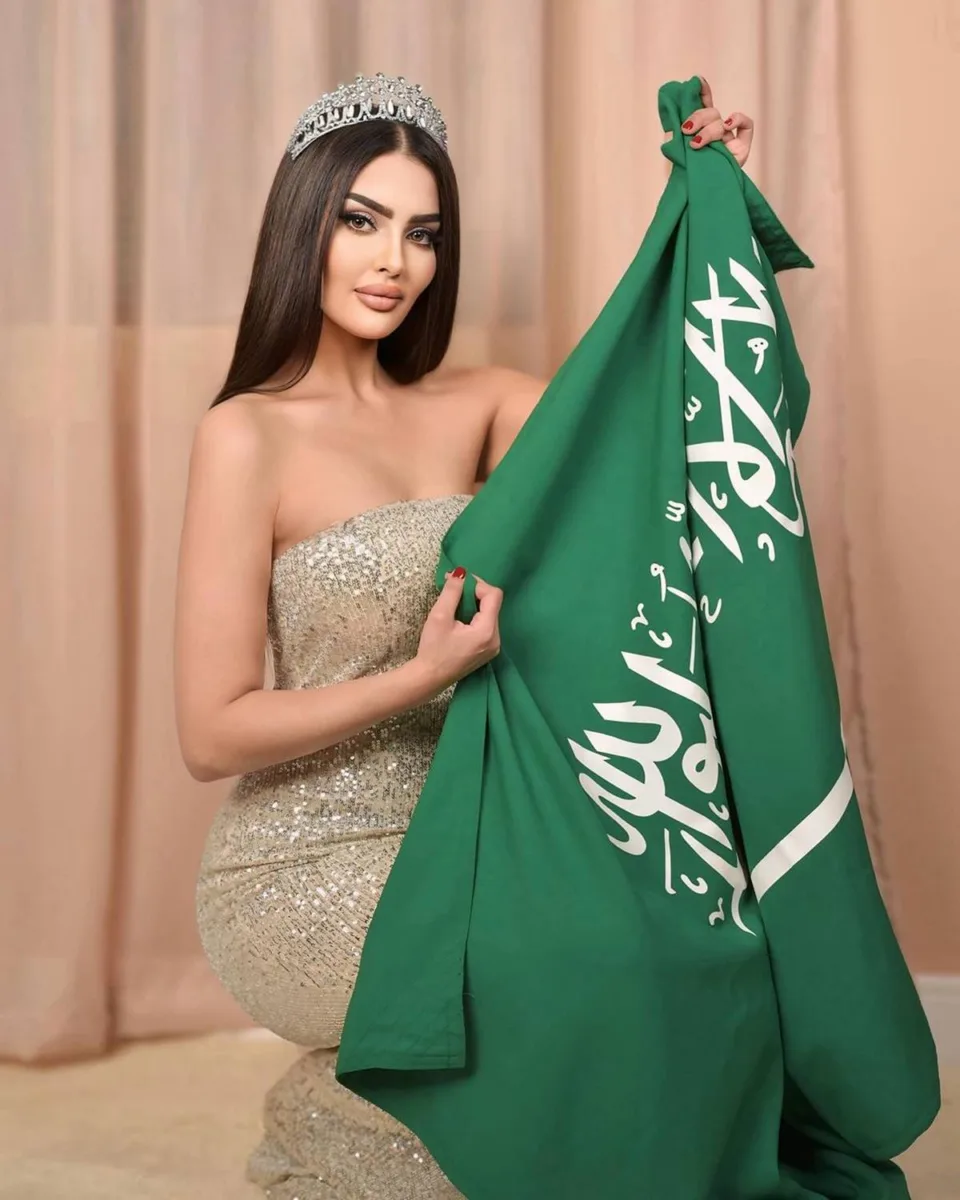 Saudi Arabia Model Rumy Alqahtani Holding Saudi Arabia Flag Announcing Kingdom's First Participation in Miss Universe